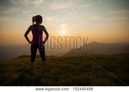 Beautiful Young Woman Runns Cross Country On A Mountian Path At Sunrise