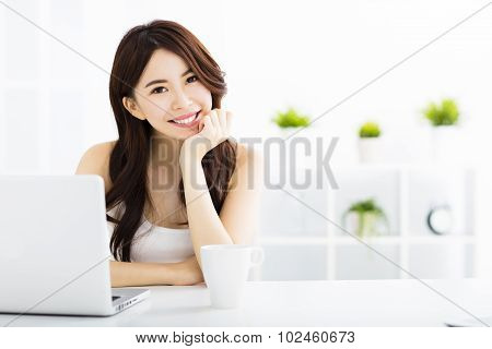Young Smiling Asian Woman  With Laptop