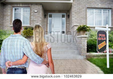 Young loving couple looking at new home. Mortgage.