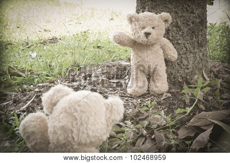 Teddybears at the park, waving goodbye