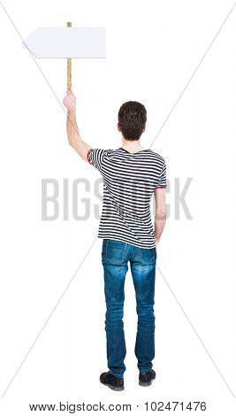 Back view man showing sign board. man holds information plate. Rear view people collection. backside view of person. Isolated over white background. The guy in striped shirt points to right pointer.
