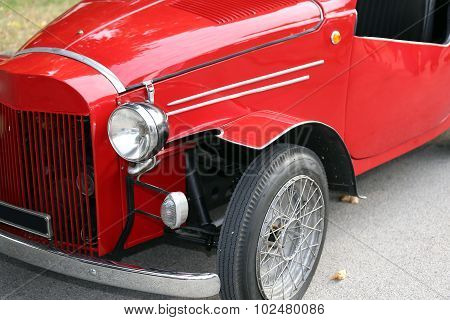 detail of red italian vintage car very old
