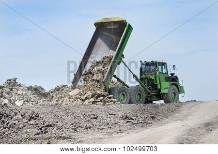 Dump Truck Unloading Dirt