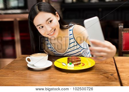 Girl In Cafe Shop Texting On Smartphone
