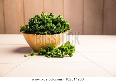 Fresh kale in a bowl on the table