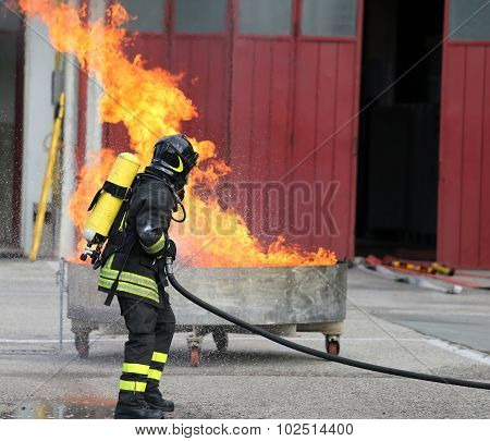 Firefighters With Oxygen Bottles Off The Fire During A Training Exercise