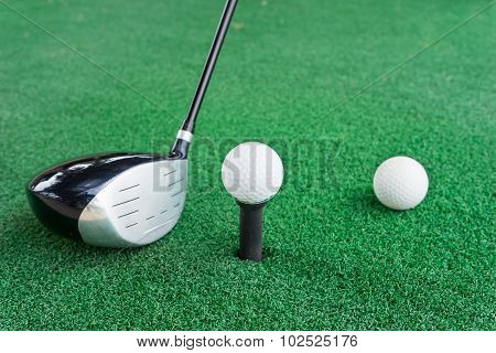 Close-up Of A Golf Ball And A Golf Wood On A Driving Range