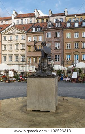 WARSAW, POLAND - SEPTEMBER 16, 2015: Statue of Mermaid at Old Town Market Place on 16 September 2015 in Warsaw, Poland. Mermaid made by the sculptor Konstanty Hegel is the symbol of Warsaw.