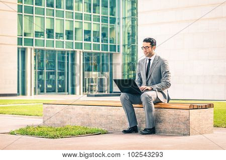 Young Hipster Business Man Sitting With Laptop At Business Center - Modern Concept Of Technology