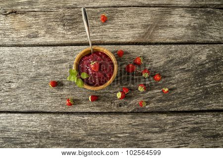 Top View Of Delicious Freshly Made Fruit Jam In A Small Bowl Decorated With Mint Leaves