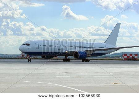 Large Passenger Plane Was Taxiing For Take-off In Summer