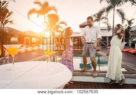 People Dancing In Front The Swimming Pool