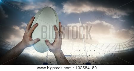 A rugby player scoring a try against rugby stadium