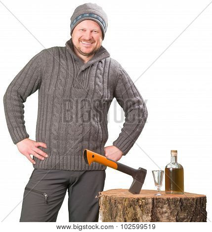 Forester with axe and bottle of alcohol smiling