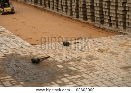 induration sand and laying paving slabs