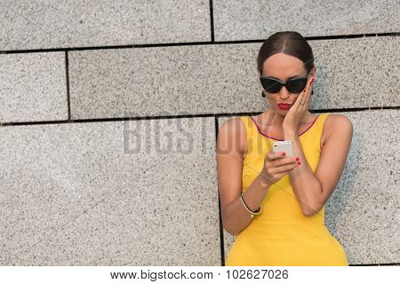 Fashion girl with mobile phone