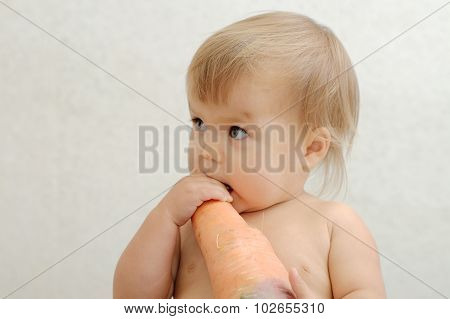Baby Scrunching Big Carrot