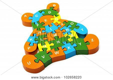 wooden colored puzzle in bear form with letters