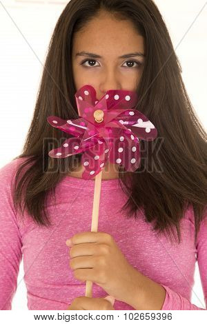 Cute Dark Complected Teen Girl Holding A Toy Windmill