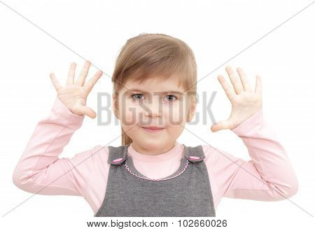 little girl rises hends up and shows ten fingers on white