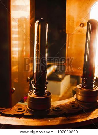 Plastic preform before the heating furnace.
