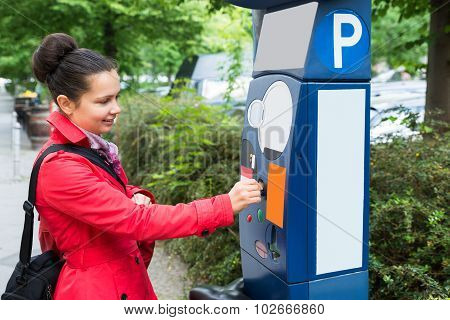 Woman Inserting Coin In Parking Meter