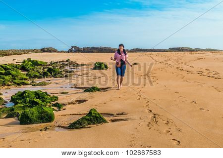 Girl visiting beach in Oualidia, Atlantic coast of Morocco