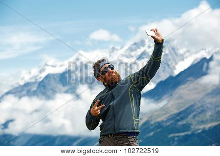 hiker at the top of a pass