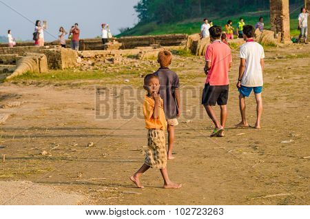 Sangkhlaburi Thailand - May 4 2014: Unidentified young asian Mon boy with friends at Old temple in SangkhlaburiThailand.