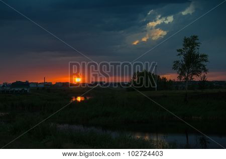Sunset over calm lake