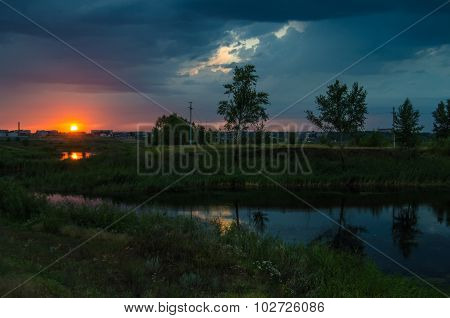 Sunset over calm lake