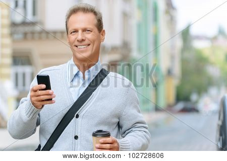 Pleasant man standing in the street