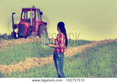 Woman With Laptop In The Field