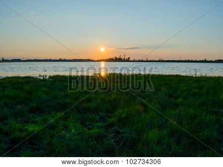 Sunset over calm lake