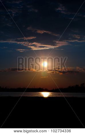 Sunset over calm lake