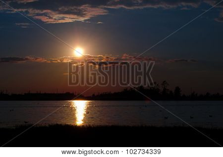 Sunset over calm lake