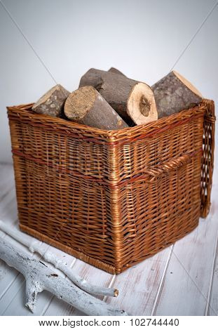 Logs In Wicker Basket