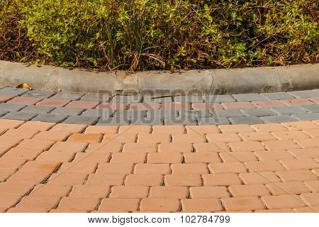 Walkway Pattern Of Small Brick Beside The Garden On Wayside