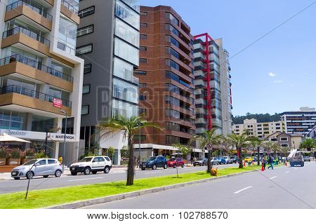 Great image from modern part of Quito mixing new architecture with charming streets and green sourro