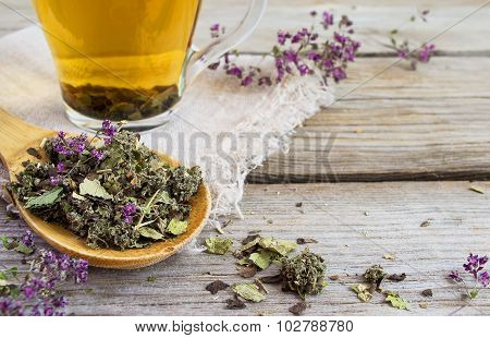Dry Herb Tea On A Background Of Cups With Tea