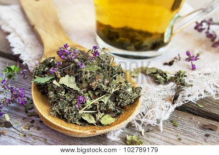 Wooden Spoon With Dry Herbal Tea.
