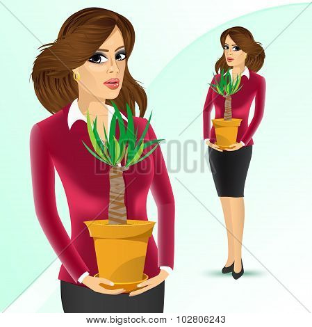 business woman holding yucca plant