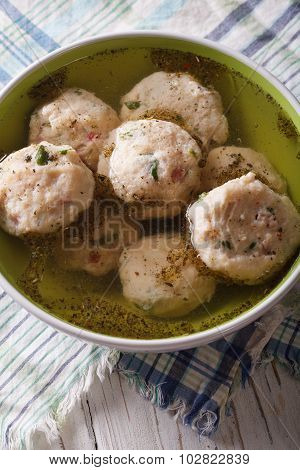 Bread Dumplings With Broth, Close-up  On The Table. Vertical Top View