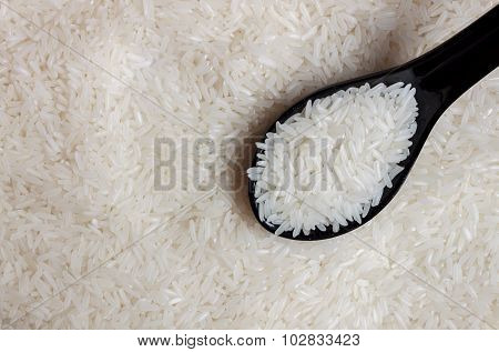 Grain Rice, Spoon On Grain Rice Background.