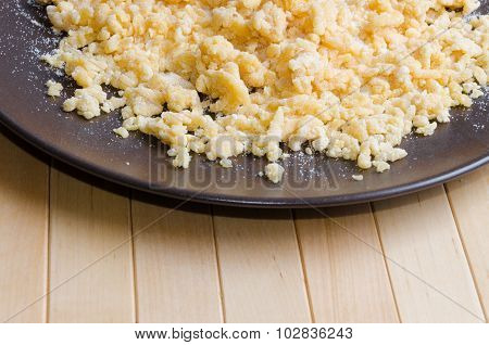 Flour drip on dark brown plate