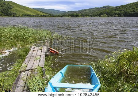 Flooded boat on the lake.
