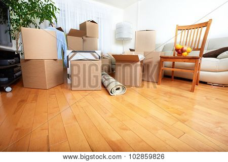 Moving boxes in new apartment. Real estate concept.