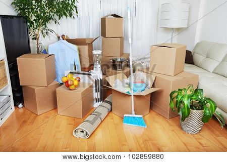Moving boxes in new apartment. Real estate concept.