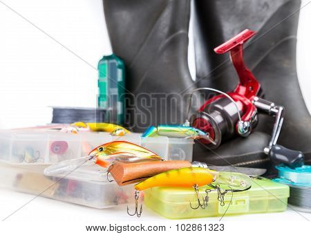 Fishing Tackles And Rubber Boots On White