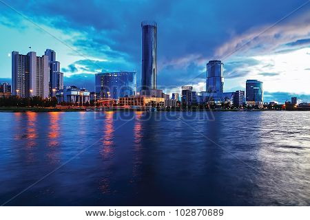 City At Night With Colored Lights Business Building